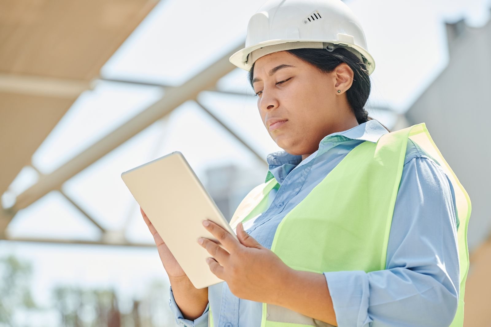 Construction project team reviewing plans on-site